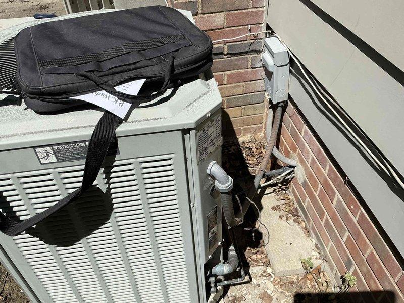 Provided comprehensive estimate for complete HVAC system replacement at residential property with approximately 2,200 square feet. Existing Trane XL 80 furnace and outdoor condensing unit, both installed circa 1998, have reached end of service life with air conditioning system no longer operational as of the previous week. Assessment included evaluation of indoor furnace unit located in basement mechanical room with existing ductwork configuration and outdoor heat pump/AC unit positioned against exterior brick wall with associated refrigerant lines, electrical connections, and condensate drainage systems.