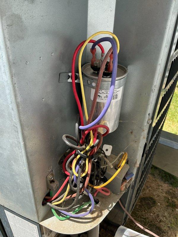 Completed routine cooling maintenance on residential HVAC system. Inspected outdoor condensing unit electrical components including capacitor and associated wiring connections, verified proper terminal connections and component condition. Performed indoor air handler inspection, checked ductwork connections, and verified system operational status for continued reliable cooling performance.