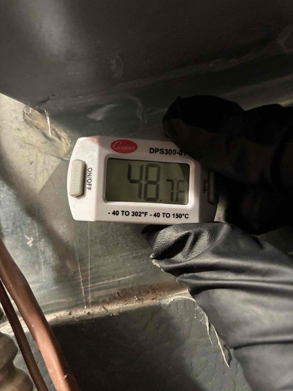 Completed scheduled cooling system maintenance on outdoor AC unit. Performed electrical diagnostics using clamp meter, verifying proper amperage draw and system performance. Measured supply air temperature at 48°F, confirming adequate cooling output and proper refrigerant charge. All system components operating within normal parameters.