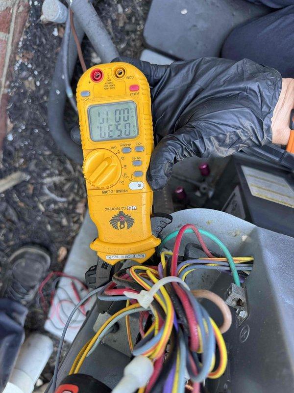 Responded to customer complaint of air conditioning unit not cooling properly and making unusual noise during operation. Upon arrival, performed diagnostic testing of the outdoor condensing unit using digital multimeter to check electrical values at the terminal block. Testing revealed faulty capacitor, which was causing the reported noise and reduced system performance. Removed defective capacitor and installed new replacement unit. Verified proper electrical readings across all connections and tested system operation to confirm normal function restored with no abnormal sounds present.