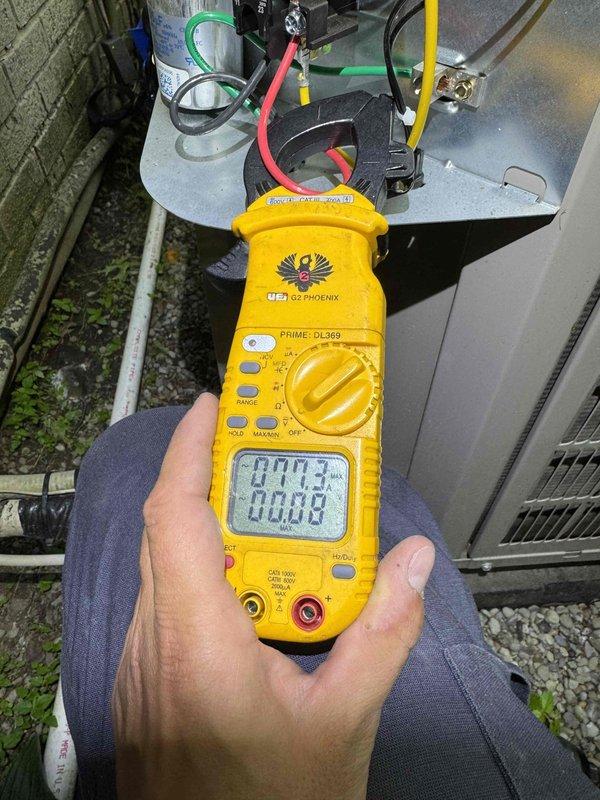 # HVAC Cooling Maintenance - Two Systems

Completed comprehensive cooling maintenance on two HVAC systems as part of ongoing preventive maintenance program. Performed electrical diagnostics using digital multimeter to verify proper voltage and amperage readings at outdoor unit control panel. Measured operational parameters showing 0.713V and 0.008V readings during system testing. Inspected control board circuitry, including CEBD43|283-03_B interface board with multiple capacitors, terminal connections, and wire harnesses. Verified all electrical connections at terminal blocks with proper color-coded wiring (red, green, black, white, yellow, and brown/orange conductors). Confirmed control board functionality and secure mounting on equipment housing. Both systems operating within normal parameters upon completion of maintenance procedures.