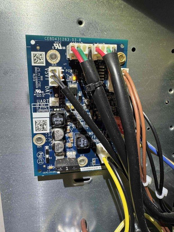 # HVAC Cooling Maintenance - Two Systems

Completed comprehensive cooling maintenance on two HVAC systems as part of ongoing preventive maintenance program. Performed electrical diagnostics using digital multimeter to verify proper voltage and amperage readings at outdoor unit control panel. Measured operational parameters showing 0.713V and 0.008V readings during system testing. Inspected control board circuitry, including CEBD43|283-03_B interface board with multiple capacitors, terminal connections, and wire harnesses. Verified all electrical connections at terminal blocks with proper color-coded wiring (red, green, black, white, yellow, and brown/orange conductors). Confirmed control board functionality and secure mounting on equipment housing. Both systems operating within normal parameters upon completion of maintenance procedures.