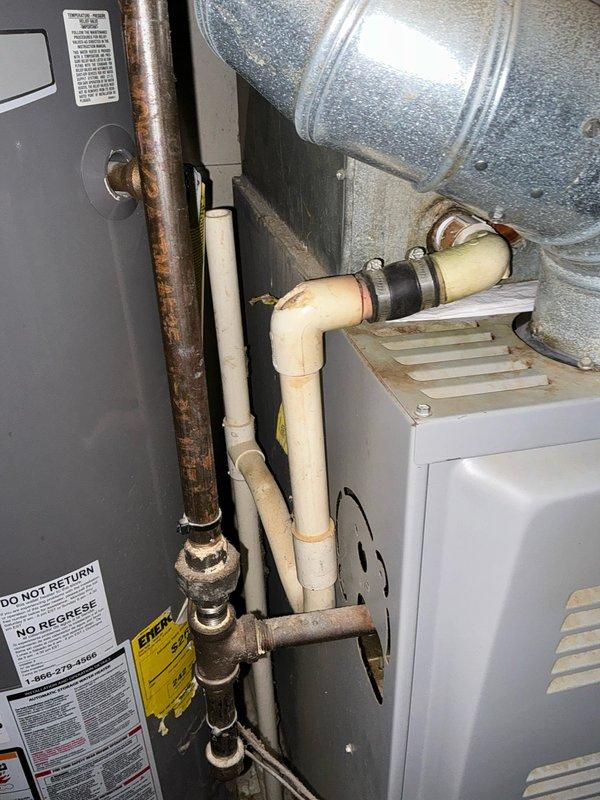 Conducted comprehensive assessment of existing HVAC system showing significant age-related deterioration, including heavily corroded copper refrigerant lines and aging air handler equipment. Presented customer with multiple replacement options including full system replacement and air conditioning unit replacement only, documented current system condition through detailed photography of equipment cabinet, ductwork, refrigerant piping, and electrical components to support estimate recommendations.