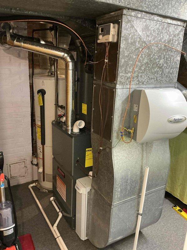 # HVAC Cooling Maintenance Summary

Completed scheduled preventive maintenance on residential cooling system as part of ongoing service plan. Performed standard seasonal inspection of air conditioning equipment, including electrical measurements showing 44.2 amp draw on compressor circuit. Inspected furnace unit, Aprilaire humidifier, ductwork connections, and associated mechanical components in basement utility area. All equipment operating within normal parameters with no deficiencies noted requiring immediate attention.

---

## Detailed Service Description

Performed comprehensive cooling season maintenance on residential HVAC system located in basement mechanical room. Conducted thorough inspection and testing of air conditioning equipment to ensure optimal performance for upcoming cooling season.

**Electrical Testing and Measurements:**
Utilized digital clamp meter to measure operating amperage on outdoor condensing unit compressor circuit, recording 44.2 amps. Verified electric