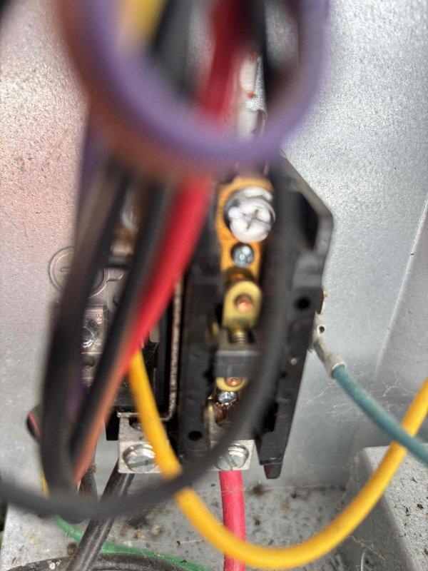 Performed scheduled HVAC cooling system maintenance on residential unit. Inspected electrical connections at control board, verified proper wire terminations and secure mounting of terminal block. Examined blower wheel assembly, noting dust accumulation on fins and end plate but confirming proper mechanical operation and secure mounting hardware.