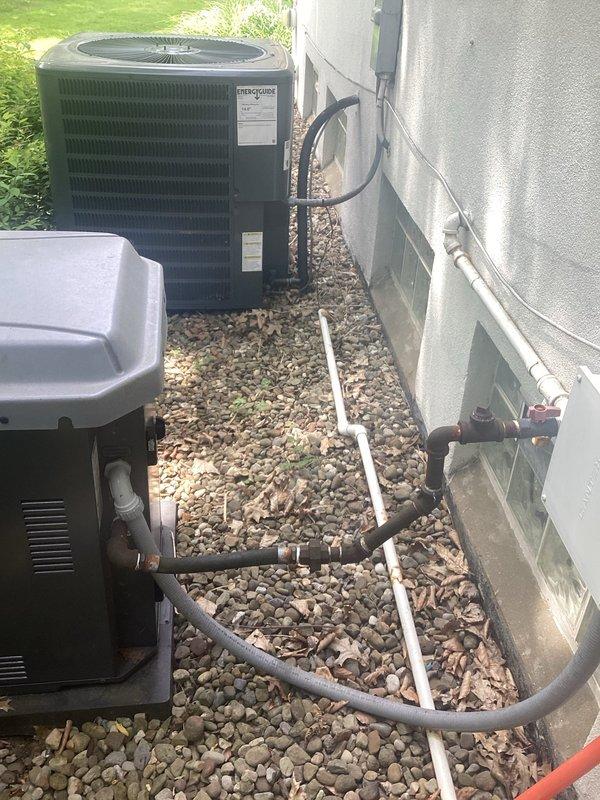 Conducted site evaluation for generator installation at residential property currently equipped with existing HVAC systems. Assessed electrical service capacity, available installation space adjacent to existing condenser units on gravel pad, and determined optimal generator placement considering clearance requirements from equipment and structure. Documented existing electrical panel configuration, conduit routing, and transfer switch location requirements. Photographed current outdoor mechanical equipment layout including air handler, condensing unit, refrigerant line sets, and electrical junction boxes to develop comprehensive generator integration plan. Prepared detailed estimate for standby generator system installation including automatic transfer switch, gas line connection, concrete pad placement, and electrical connections to main service panel.