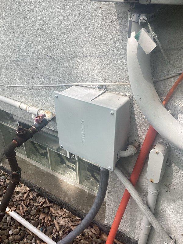 Conducted site evaluation for generator installation at residential property currently equipped with existing HVAC systems. Assessed electrical service capacity, available installation space adjacent to existing condenser units on gravel pad, and determined optimal generator placement considering clearance requirements from equipment and structure. Documented existing electrical panel configuration, conduit routing, and transfer switch location requirements. Photographed current outdoor mechanical equipment layout including air handler, condensing unit, refrigerant line sets, and electrical junction boxes to develop comprehensive generator integration plan. Prepared detailed estimate for standby generator system installation including automatic transfer switch, gas line connection, concrete pad placement, and electrical connections to main service panel.
