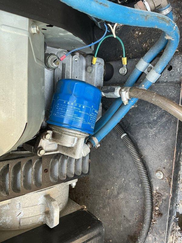 Performed scheduled generator maintenance including inspection of critical components and air filtration system. Cleaned heavily soiled air filter showing significant dust and debris accumulation, and verified proper operation of suspension-mounted generator assembly with associated electrical connections and wiring harnesses intact.