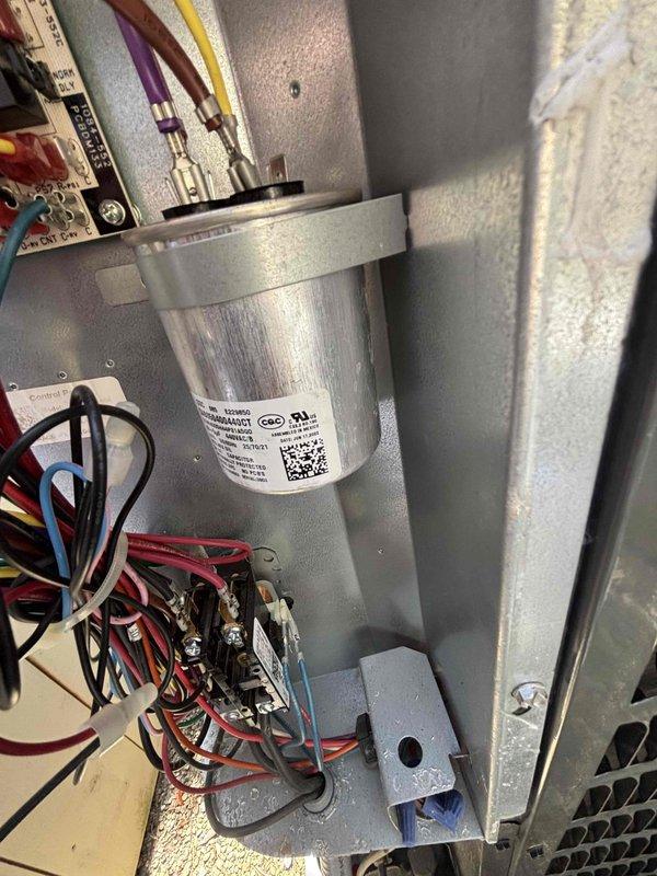 # HVAC Maintenance - Cooling System

Performed comprehensive annual maintenance on residential air conditioning system. Conducted thorough inspection of outdoor condensing unit and indoor air handler components.

## Outdoor Unit Service

Inspected condenser coil and found moderate dirt and debris accumulation affecting heat transfer efficiency. Performed chemical coil cleaning using professional-grade coil cleaner to remove buildup and restore optimal airflow. Cleaned condenser fan blade and housing. Checked refrigerant pressures and verified system charge levels are within manufacturer specifications. Inspected electrical connections at contactor and capacitor for signs of wear or overheating. Measured voltage and amperage at compressor and condenser fan motor to confirm proper operation within nameplate ratings.

## Indoor Unit Service

Accessed air handler and inspected evaporator coil assembly. Cleaned evaporator coil to remove dust and biological growth that can restrict airflow a