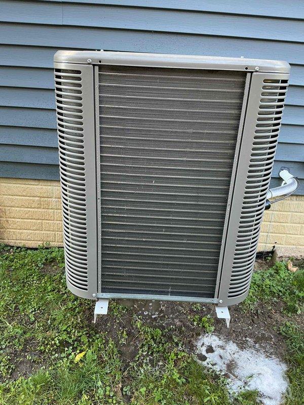 Completed scheduled preventive maintenance on residential split-system air conditioning unit. Upon arrival, outdoor condenser unit exhibited heavy accumulation of dirt, dust, and debris on intake surfaces and coil fins, which significantly restricts airflow and reduces system efficiency. Performed thorough cleaning of condenser coils using appropriate methods to remove fibrous buildup and restore proper heat exchange capability. Cleared debris from around unit perimeter and verified proper clearances for adequate ventilation. Inspected refrigerant lines, electrical connections, and mounting hardware for secure installation and proper condition. Unit operational and running within normal parameters upon completion of maintenance service.