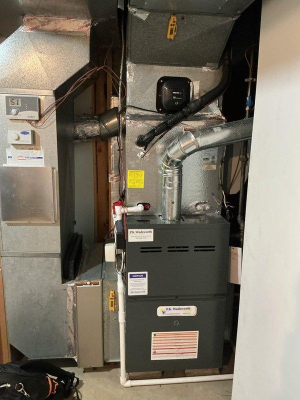Completed scheduled preventive maintenance on residential cooling system. Performed comprehensive inspection of HVAC equipment including furnace, air handler, and ductwork components. Evaluated evaporator coil condition, noting significant frost accumulation on coil surface with temperature reading of 29.3°F, indicating proper refrigerant charge and system operation under load. Inspected ductwork connections, flexible conduits, and airflow pathways for proper sealing and functionality. Verified all system components, control panels, and safety devices operating within manufacturer specifications. System tested and confirmed operational for continued cooling season performance.