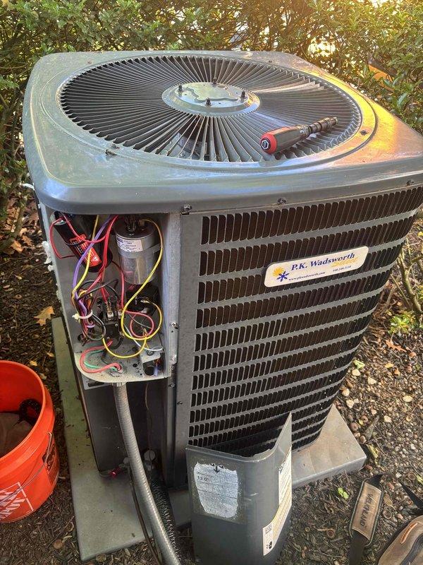 Completed routine cooling system maintenance on residential air conditioning unit. Performed comprehensive inspection of outdoor condensing unit, including examination of condenser coils, fan assembly, and electrical components. Accessed control panel to verify proper operation of circuit board, capacitor, and associated wiring connections. Removed debris and fallen leaves from around unit exterior to ensure adequate airflow and system efficiency.