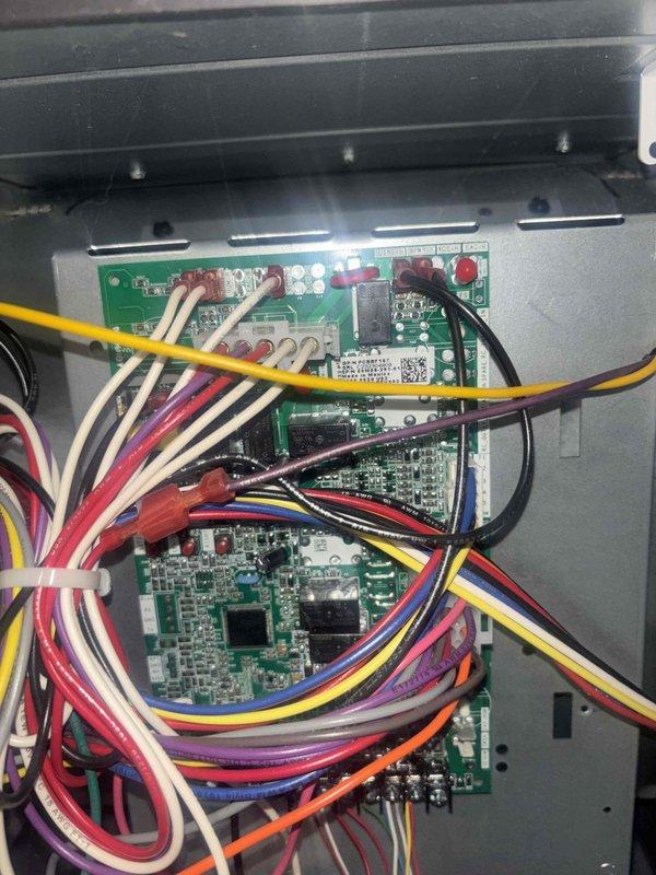 Completed comprehensive cooling system maintenance on residential air conditioning unit. Performed inspection of outdoor condenser unit, including examination of cabinet condition, fan assembly, and electrical components. Verified proper operation of control boards and wiring connections within system housing, confirming all circuit boards functioning correctly and electrical connections secure.