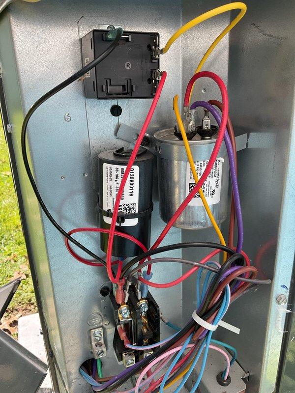 Completed scheduled cooling system preventive maintenance on residential air conditioning unit. Accessed electrical control panel to inspect contactor, dual run capacitor, and all electrical connections. Verified proper wiring integrity, tested capacitor values, and confirmed all electrical components operating within manufacturer specifications. System tested and operating normally upon completion.