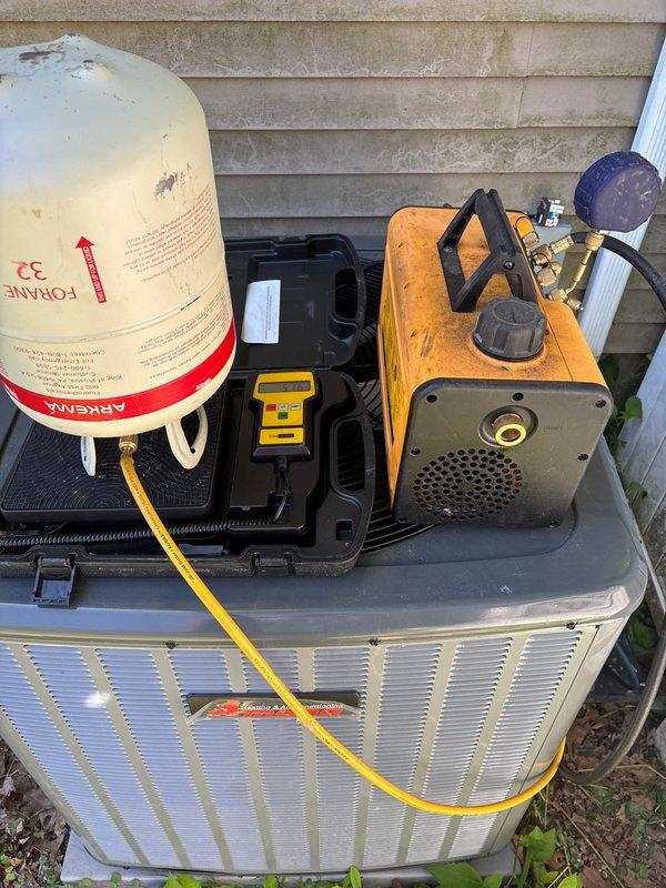 Repaired refrigerant leak on suction line at condenser unit. Performed leak detection using electronic refrigerant leak detector, brazed damaged section of suction line, evacuated system to 500 microns, and recharged unit to manufacturer specifications.