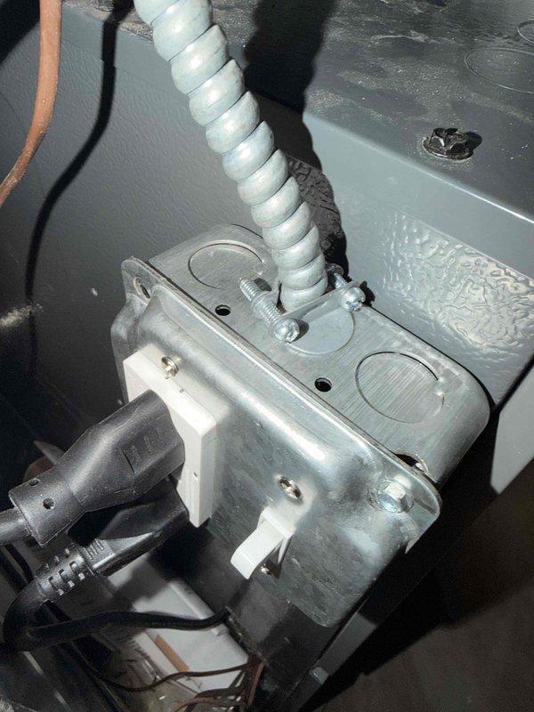 Completed warranty inspection and corrective work on HVAC installation to ensure compliance with 2023 NEC standards. Properly secured and connected MC cable per NEC 330.6 and 330.30(B) requirements, securely mounted junction box to furnace, repositioned single pole toggle switch to correct orientation, and installed filter covers. Documented all corrective work with photographs showing proper electrical connections, conduit routing, and junction box mounting.