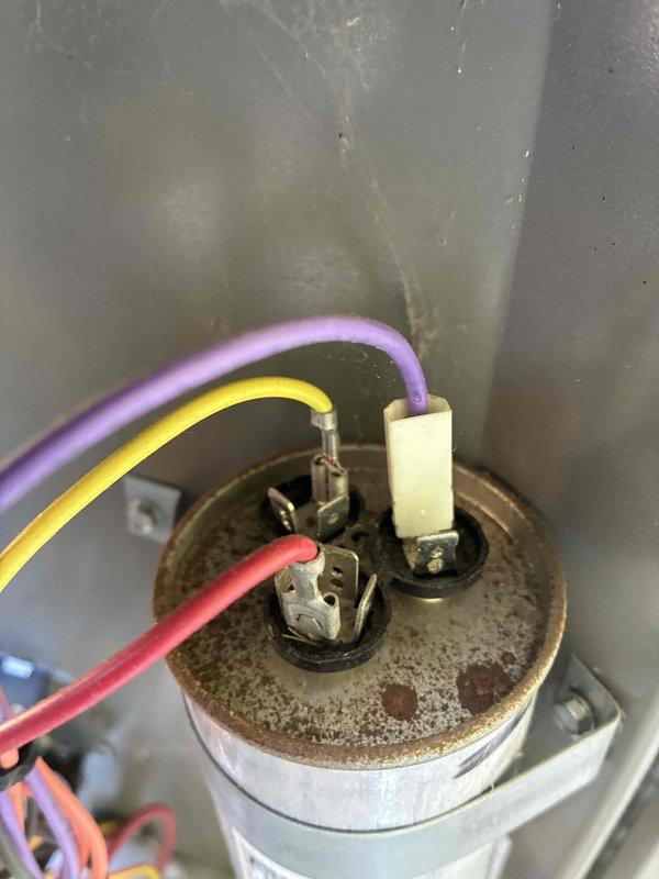 Completed comprehensive cooling system tune-up including inspection of electrical connections, capacitor, and control wiring. Verified all terminal connections secure, checked capacitor condition and electrical components within normal operating parameters, and confirmed proper wire routing and system functionality.