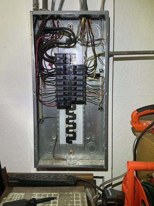 Performed comprehensive electrical inspection of residential main service panel to assess compatibility and requirements for whole home surge protection device installation. Documented existing panel configuration, including circuit breaker layout, wire routing, and available space for surge protector integration. Panel examination revealed standard residential setup with dual-column breaker arrangement and multiple branch circuits entering through top-mounted conduits. Evaluated electrical infrastructure to determine optimal surge protection solution and installation approach for customer consideration.