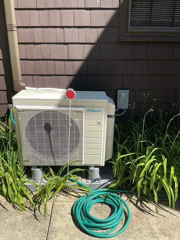 Completed routine cooling maintenance on Daikin outdoor condenser unit. Performed system inspection, cleaned condenser coils, verified proper airflow through louvers, and confirmed all electrical connections and refrigerant lines were secure and operating within normal parameters.