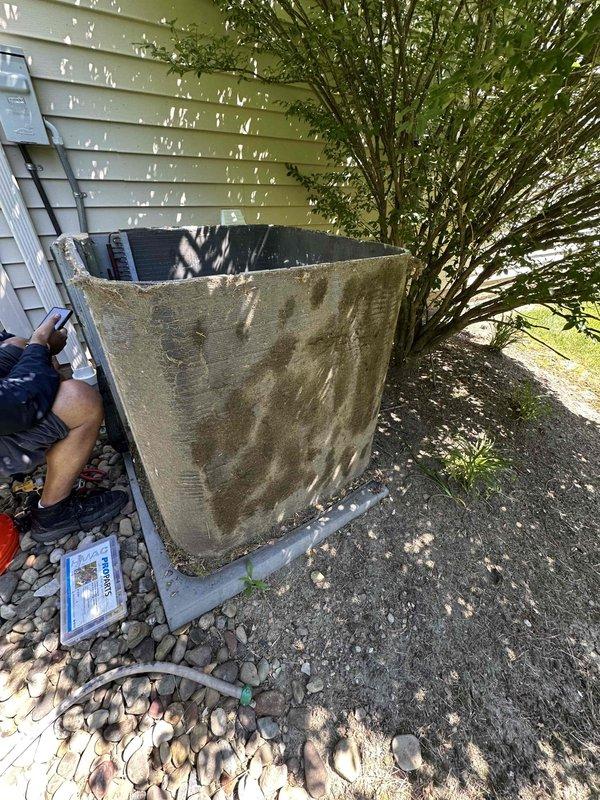 Returned to complete repair work on outdoor condensing unit. Replaced failed condenser fan motor, run capacitor, and contactor. Installed hard start kit to assist compressor during startup cycles. Performed thorough coil cleaning to remove heavy accumulation of dirt, debris, and organic material that had significantly restricted airflow. Cleared vegetation encroaching on unit to restore proper clearance for adequate ventilation and future serviceability. Unit tested and confirmed operational upon completion.