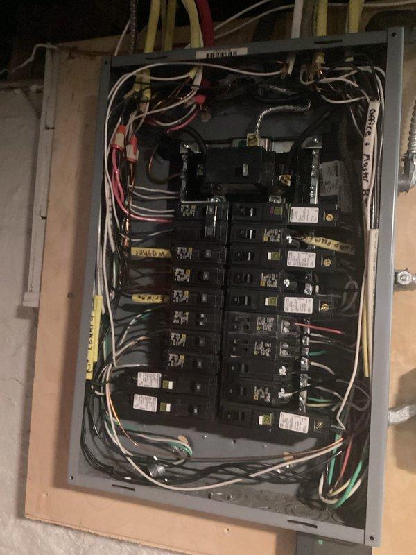 Responded to service call for intermittent tripping of breaker 17 serving kitchen stove circuit, occurring approximately once weekly when toaster was operated. Investigated electrical panel and associated wiring following recent whole-home rewire completed in November. Inspected panel interior, verified all breaker connections, and examined circuit wiring routing through floor joists to kitchen area. Documented existing electrical installation conditions including panel configuration, breaker arrangement, and wire management for quality assurance purposes.