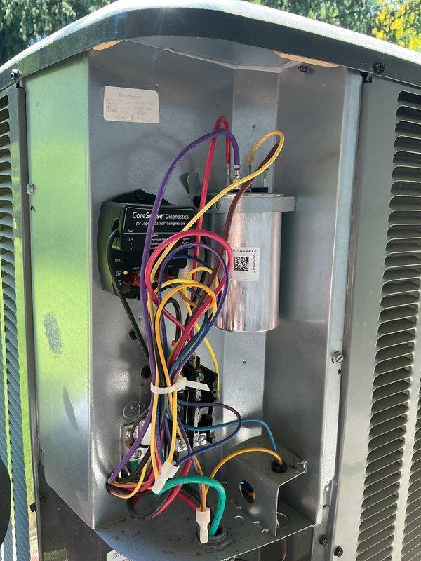 # HVAC Cooling Maintenance - Two Systems

Completed comprehensive preventive maintenance on two outdoor air conditioning units. Performed thorough inspection of electrical components including contactors, capacitors, and control modules on both systems. Verified proper wire connections and routing, checked for signs of wear or deterioration on all electrical contacts and terminals. Inspected CoreSense diagnostic module functionality on one unit. Assessed overall condition of both units' electrical compartments, noting normal weathering consistent with outdoor exposure. All components found operational and systems returned to service in good working condition.
