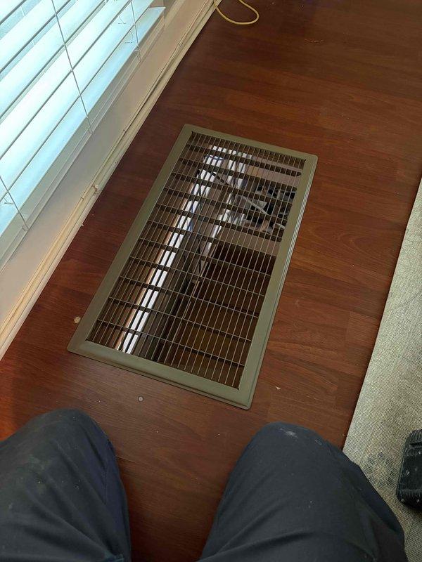 Completed warranty work involving installation of return air pathway and thermostat wiring. Cut in new floor register in hardwood flooring to establish proper return air flow for the HVAC system. Register installed with appropriate metal grille and louvers for optimal air circulation. Verified all ductwork connections at furnace unit are secure and properly sealed. System tested and confirmed operational with adequate airflow through new return pathway.