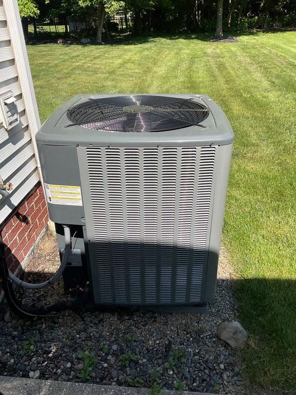 Completed comprehensive cooling season maintenance on residential air conditioning system. Performed visual inspection of outdoor condenser unit, verified proper operation of fan assembly, checked refrigerant line connections for security and signs of leakage, and confirmed unit was level on gravel pad with adequate clearance for airflow. System operating within normal parameters upon completion of maintenance procedures.