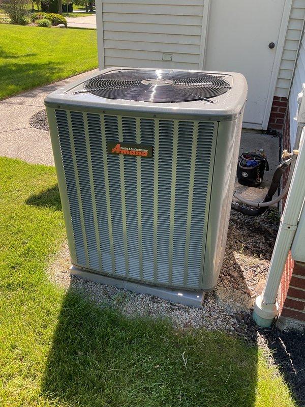 Completed comprehensive cooling season maintenance on residential air conditioning system. Performed visual inspection of outdoor condenser unit, verified proper operation of fan assembly, checked refrigerant line connections for security and signs of leakage, and confirmed unit was level on gravel pad with adequate clearance for airflow. System operating within normal parameters upon completion of maintenance procedures.