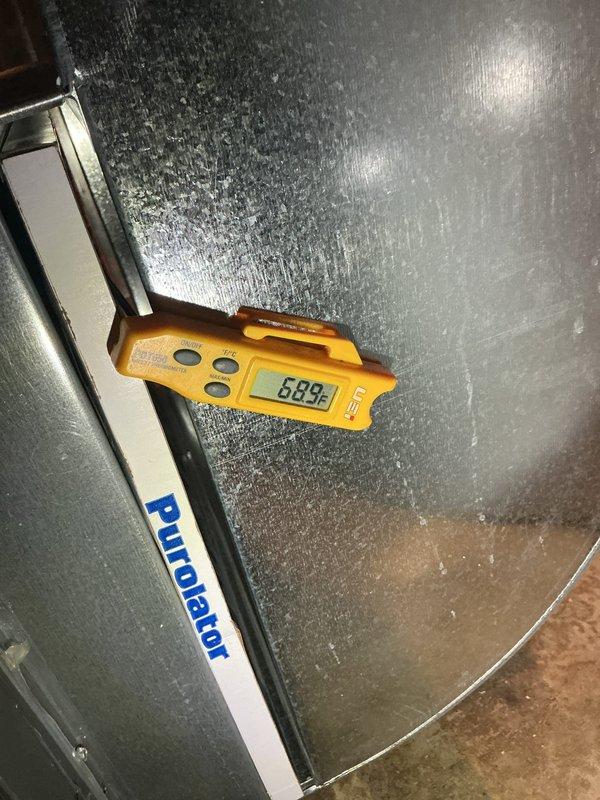 Completed annual preventive maintenance visit on residential air conditioning system. Performed comprehensive system inspection including temperature differential measurements across the evaporator coil, recording supply air temperature of 58.9°F. Tested and verified capacitor performance using clamp meter, confirming microfarad readings within manufacturer specifications at 1.02 MFD. Inspected all electrical connections, verified proper wire terminations to capacitor, and ensured outdoor condensing unit components were functioning correctly. System operating efficiently with no deficiencies noted.