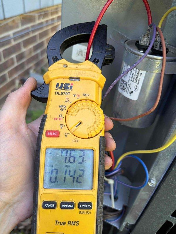Completed annual preventive maintenance visit on residential air conditioning system. Performed comprehensive system inspection including temperature differential measurements across the evaporator coil, recording supply air temperature of 58.9°F. Tested and verified capacitor performance using clamp meter, confirming microfarad readings within manufacturer specifications at 1.02 MFD. Inspected all electrical connections, verified proper wire terminations to capacitor, and ensured outdoor condensing unit components were functioning correctly. System operating efficiently with no deficiencies noted.