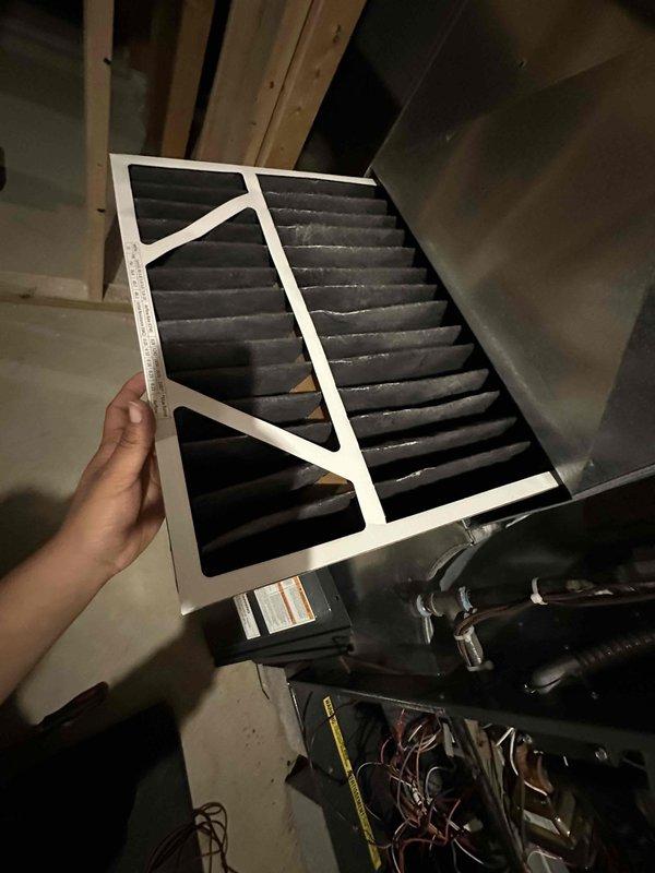 Completed scheduled preventive maintenance visit for residential cooling system. Inspected and serviced HVAC equipment including furnace unit and air handling components. Removed and examined existing pleated air filter, which showed dust accumulation consistent with normal operation. Evaluated circular pleated filter element in air handler, confirming proper installation and clean condition. Verified all system components for proper operation and airflow efficiency to ensure optimal cooling performance for the upcoming season.