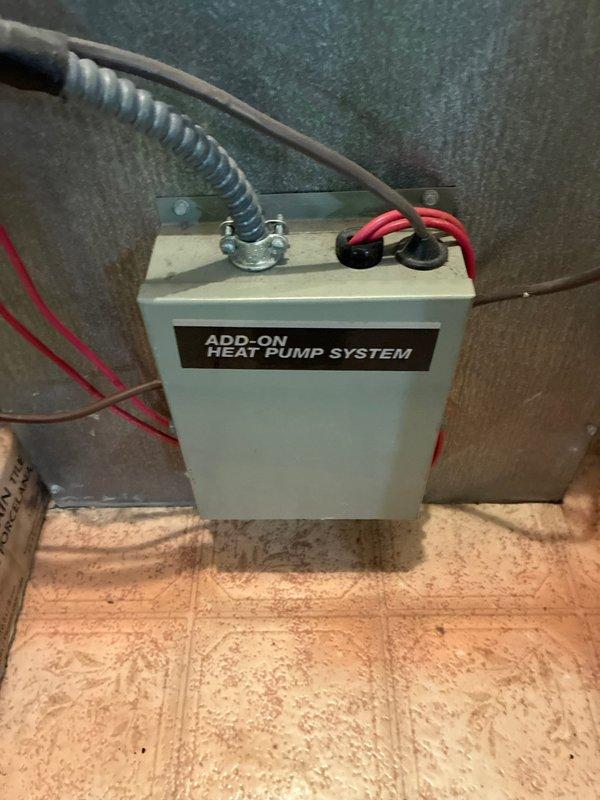 Conducted heat pump and air handler replacement estimate for townhome property. Presented three-tier equipment options ranging from 14.3 to 17.2 Nominal SEER and 7.5 to 8.2 HSPF efficiency ratings. Assessed existing electrical infrastructure including circuit breaker panel with 20A and 30A breakers, and documented current add-on heat pump system installation with associated electrical connections and conduit routing.