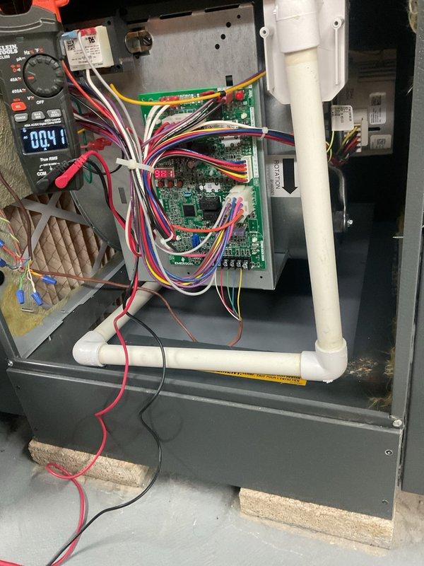 Completed comprehensive HVAC cooling and heating tune-up service on two systems. Performed diagnostic testing on indoor air handler unit, utilizing digital multimeter to verify proper electrical readings across control board circuits and connections. Inspected control board wiring harness, condensate drain lines, and air filtration system for proper operation. Conducted routine maintenance and operational checks on outdoor Generac standby generator unit to ensure backup power system functionality. All systems tested and confirmed to be operating within normal parameters upon completion of service.