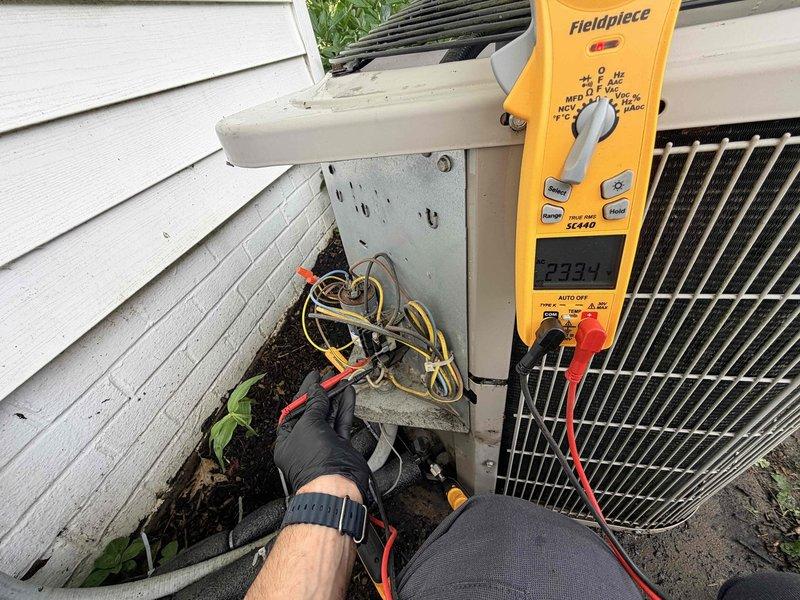 Completed scheduled cooling system maintenance on residential air conditioning unit. Performed electrical diagnostics using digital multimeter, measuring voltage and amperage at unit connections to verify proper system operation. Inspected outdoor disconnect box, tested electrical connections, and confirmed all components functioning within normal parameters.