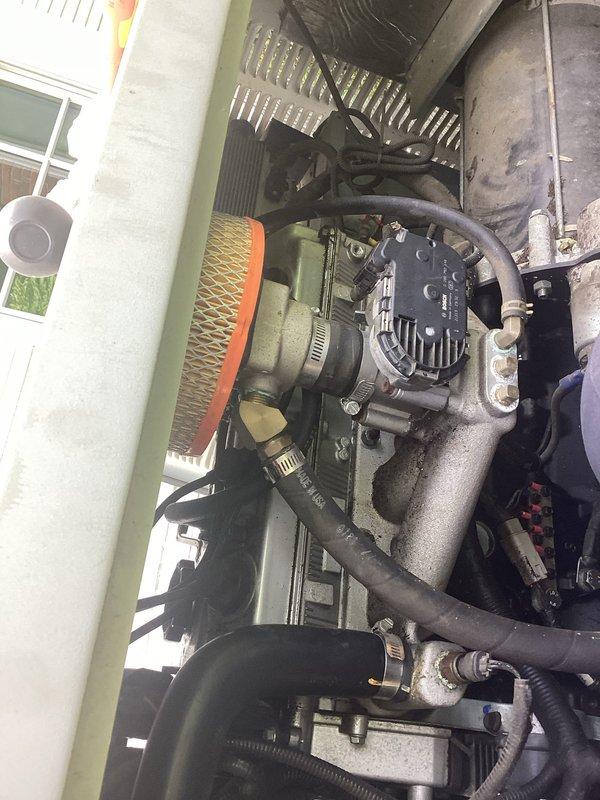 Performed scheduled maintenance on commercial generator system. Inspected internal components including compressor unit, refrigerant lines, and electrical connections. Verified all warning labels and safety documentation were properly displayed and legible on equipment exterior panel.