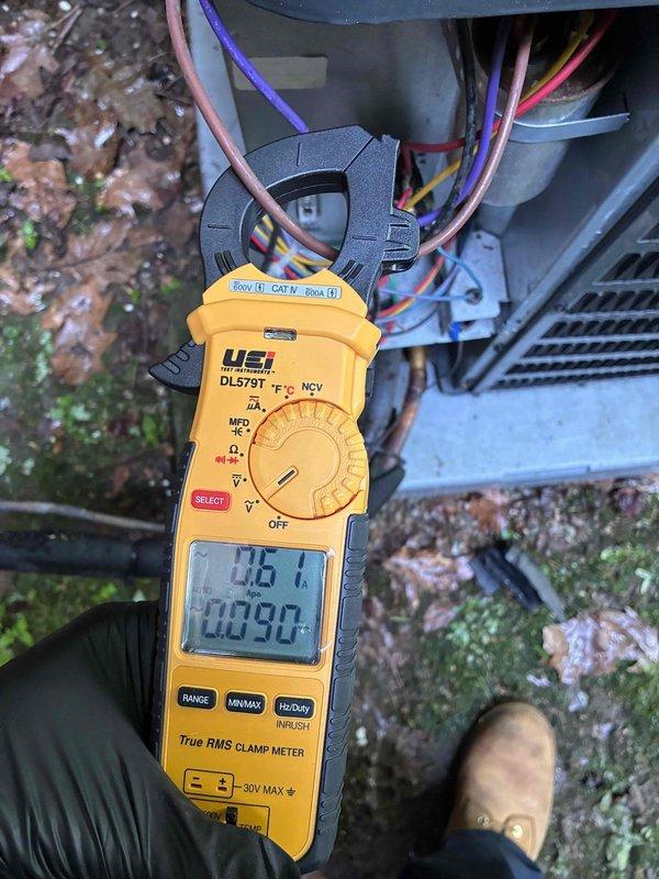 Completed scheduled cooling maintenance on two HVAC systems. Performed comprehensive diagnostic testing using digital clamp meter to verify electrical performance, measuring amperage draws and voltage levels at both outdoor units. Inspected condensing units including fan assemblies, capacitors, and electrical connections. Documented system readings showing proper voltage at 115.1V and normal operating amperages. Noted existing capacitor showing surface corrosion but functioning within acceptable parameters. Verified all electrical connections secure and system components operating as designed. Both systems tested and confirmed operational for continued cooling season performance.