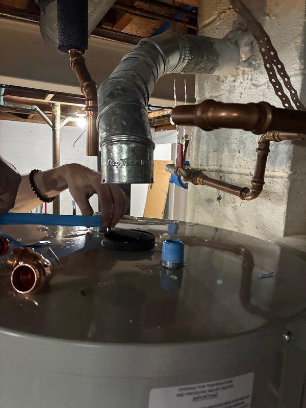 Completed warranty replacement of residential water heater by removing the existing failed unit and transporting it to the supplier for warranty processing. Installed new water heater with proper copper piping connections, pressure relief valve, and supply line fittings, ensuring all connections were properly tightened and sealed to code specifications.