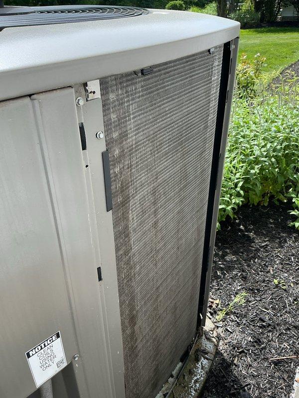 Completed routine HVAC cooling system maintenance on residential heat pump unit. Inspected outdoor condenser unit, noting dust and debris accumulation on coil surfaces; cleaned and serviced air filter assembly to restore proper airflow. Replaced humidifier filter pads with new units to ensure optimal humidity control and indoor air quality for the upcoming season.