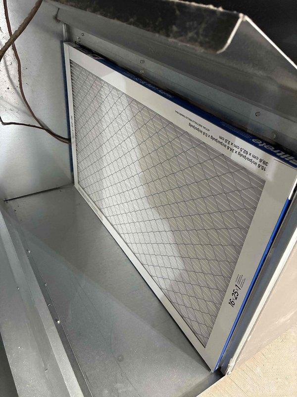 Completed cooling tune-up on residential HVAC system, including inspection of indoor air handler and outdoor condensing unit. Inspected air filter with pleated media in proper working condition, verified outdoor unit operation despite accumulated debris and vegetation growth around equipment, and documented overall system condition. Customer declined electrical inspection services.