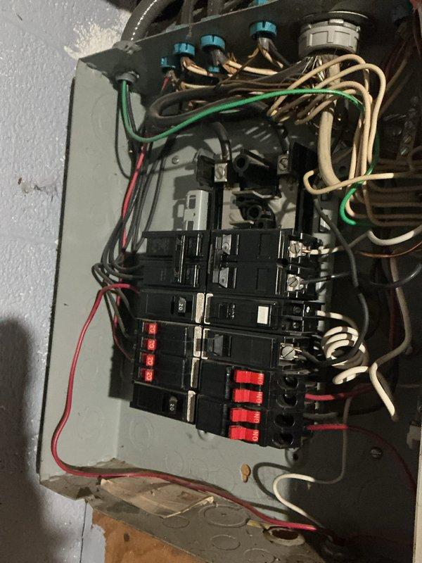 Completed complimentary electrical site visit and comprehensive safety inspection of residential electrical system. Documented existing electrical panel configuration showing multiple circuit breakers with safety tags, evaluated wire management and conductor routing within main service panel, and inspected mechanical room utility connections including plumbing interface areas. Photographed current conditions of electrical distribution system and mechanical equipment area for customer records and future reference.