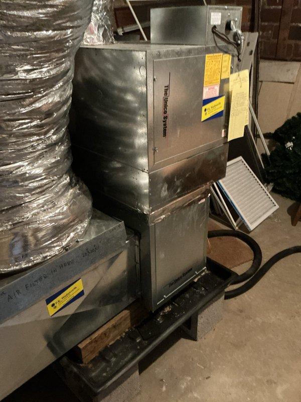 Completed scheduled cooling season maintenance on two UNICO high-velocity air conditioning systems. Performed comprehensive inspection of Frigidaire air handler unit, verified proper airflow through flexible ductwork connections, checked refrigerant levels, and replaced air filter. Both systems tested and confirmed operational for cooling season.