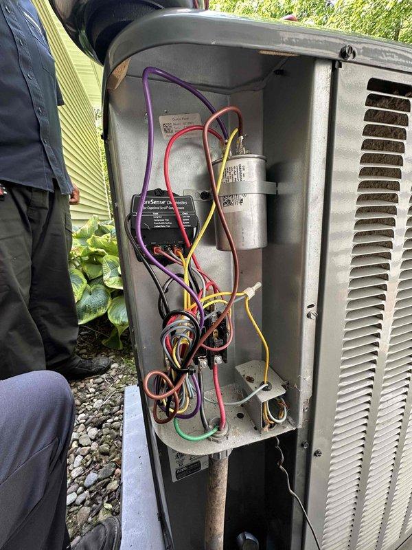 Replaced failed condenser fan motor and dual-run capacitor on outdoor HVAC unit. Removed access panel to diagnose system malfunction, disconnected faulty motor and capacitor assembly, and installed new components with proper electrical connections. Verified all wire terminations were secure, tested capacitor ratings matched system specifications, and confirmed proper operation of condensing unit before restoring power and closing access panel.
