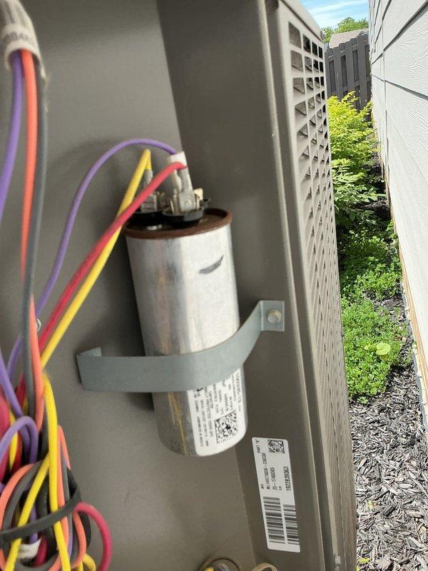 Responded to no cooling call on residential HVAC system. Upon arrival, inspected outdoor condensing unit and found failed capacitor with visible weathering and discoloration. Measured supply air temperature at interior register, which confirmed lack of cooling with reading of 103°F. Diagnosed capacitor failure as cause of system not starting, explained findings, and collected diagnostic fee.