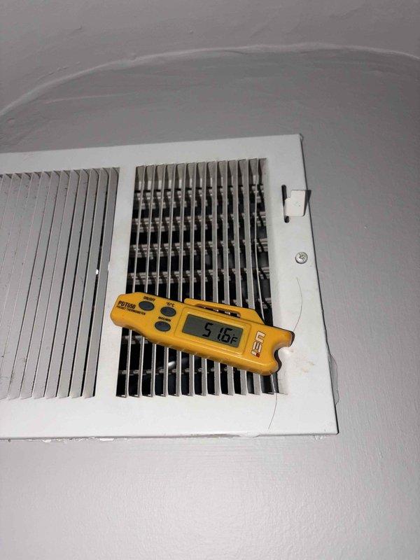 Completed scheduled preventive maintenance on residential cooling system as part of ongoing service plan. Performed comprehensive inspection of indoor air handler unit, measuring supply air temperature at ceiling register which indicated proper cooling performance at 51.6°F. Inspected outdoor condensing unit, verifying proper operation, clearance from surrounding vegetation, and adequate drainage on gravel pad. System operating within normal parameters with no deficiencies noted.