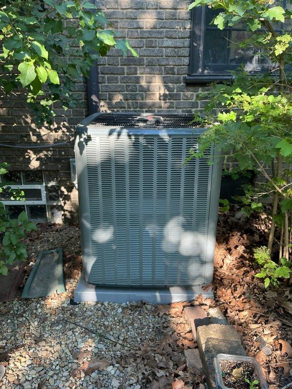 Completed scheduled preventive maintenance on residential cooling system as part of ongoing service plan. Performed comprehensive inspection of indoor air handler unit, measuring supply air temperature at ceiling register which indicated proper cooling performance at 51.6°F. Inspected outdoor condensing unit, verifying proper operation, clearance from surrounding vegetation, and adequate drainage on gravel pad. System operating within normal parameters with no deficiencies noted.