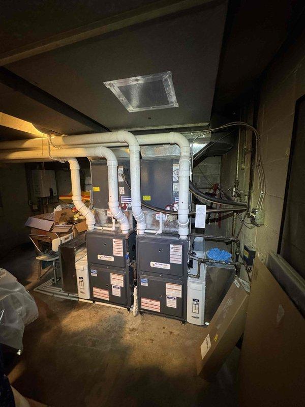 Completed preventive maintenance on two residential cooling systems. Performed comprehensive inspection of outdoor condensing units, testing electrical components including capacitors and contactors with multimeter to verify proper operation. Inspected indoor air handlers and associated furnace units in basement mechanical room, checking refrigerant line connections, condensate drainage systems, and PVC piping for proper function. All systems tested and operating within normal parameters upon completion of maintenance procedures.