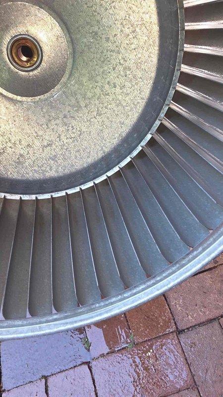 Performed blower wheel cleaning service on HVAC system. Removed heavily soiled blower wheel assembly showing significant accumulation of dust, dirt, and debris on metal blades and interior surfaces. Thoroughly cleaned all components and reinstalled unit to restore proper airflow and system efficiency.