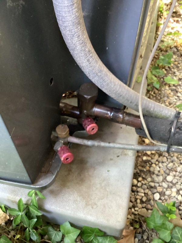 Completed comprehensive cooling maintenance on residential HVAC system, including inspection of outdoor condensing unit with service valves and refrigerant lines, and indoor air handler located in upper level space. All electrical components had been previously serviced; performed mechanical inspection, verified proper refrigerant line connections, checked service valve operation, and confirmed system readiness for cooling season operation.