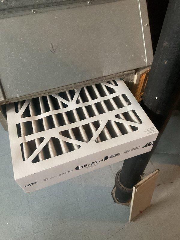 Completed comprehensive cooling season tune-up on residential HVAC system. Inspected and verified proper operation of outdoor condensing unit, including capacitor function and electrical connections. Examined 16x25x4 HDX pleated air filter at indoor air handler, confirmed adequate airflow, and documented system components for maintenance records.